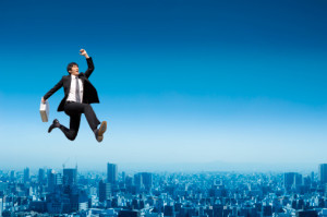 Businessman jumping in the air