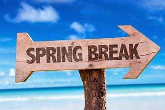 San Brisas Apartments in West Houston, TX A wooden sign with the word spring break in front of a beach.