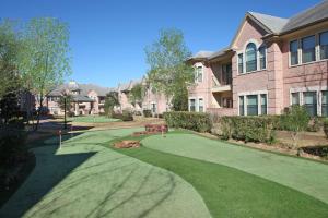 Apartments in West Houston, Texas - Putting Green and Apartment Building Exteriors